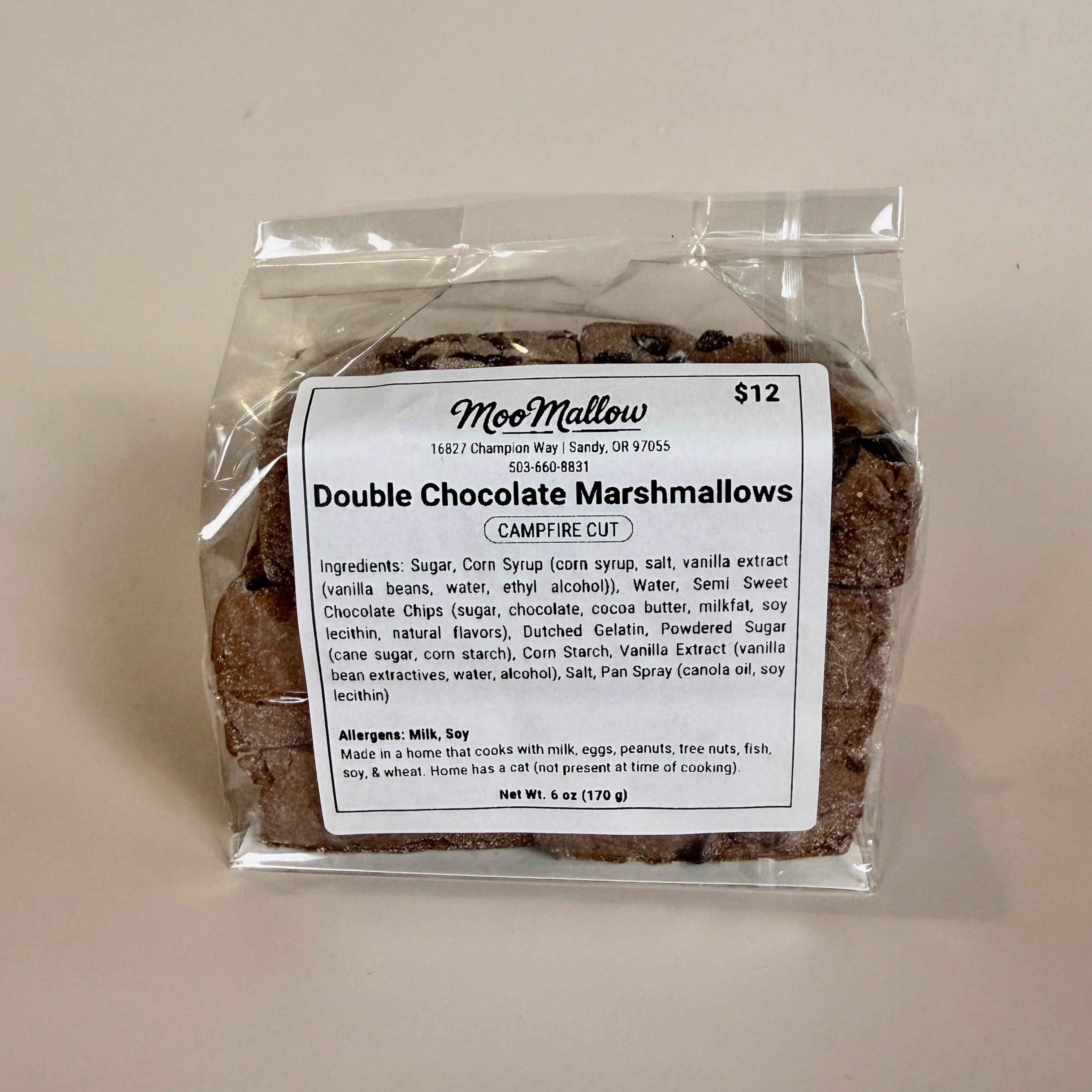 Packaged double chocolate marshmallows with a label on a beige background