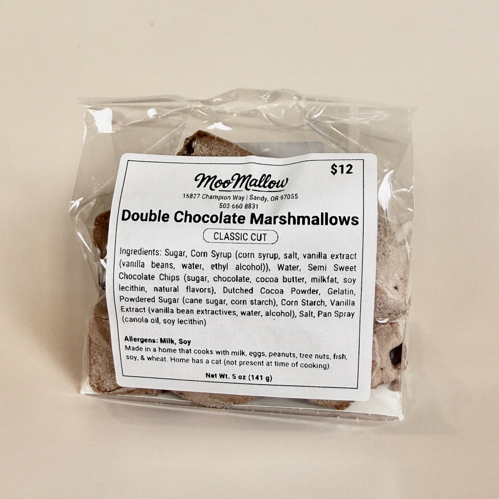 Packaged double chocolate marshmallows with a label on a beige background