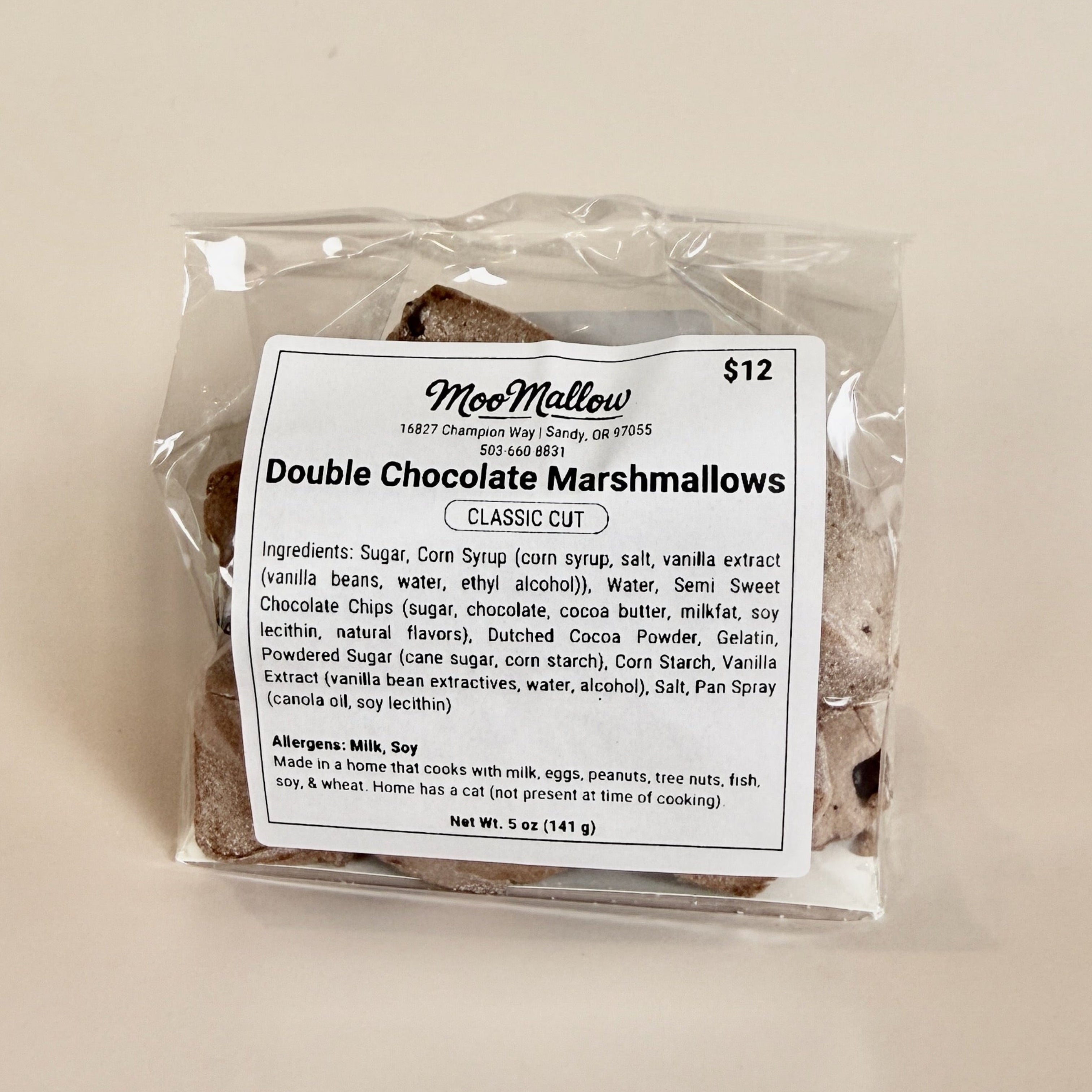Packaged double chocolate marshmallows with a label on a beige background