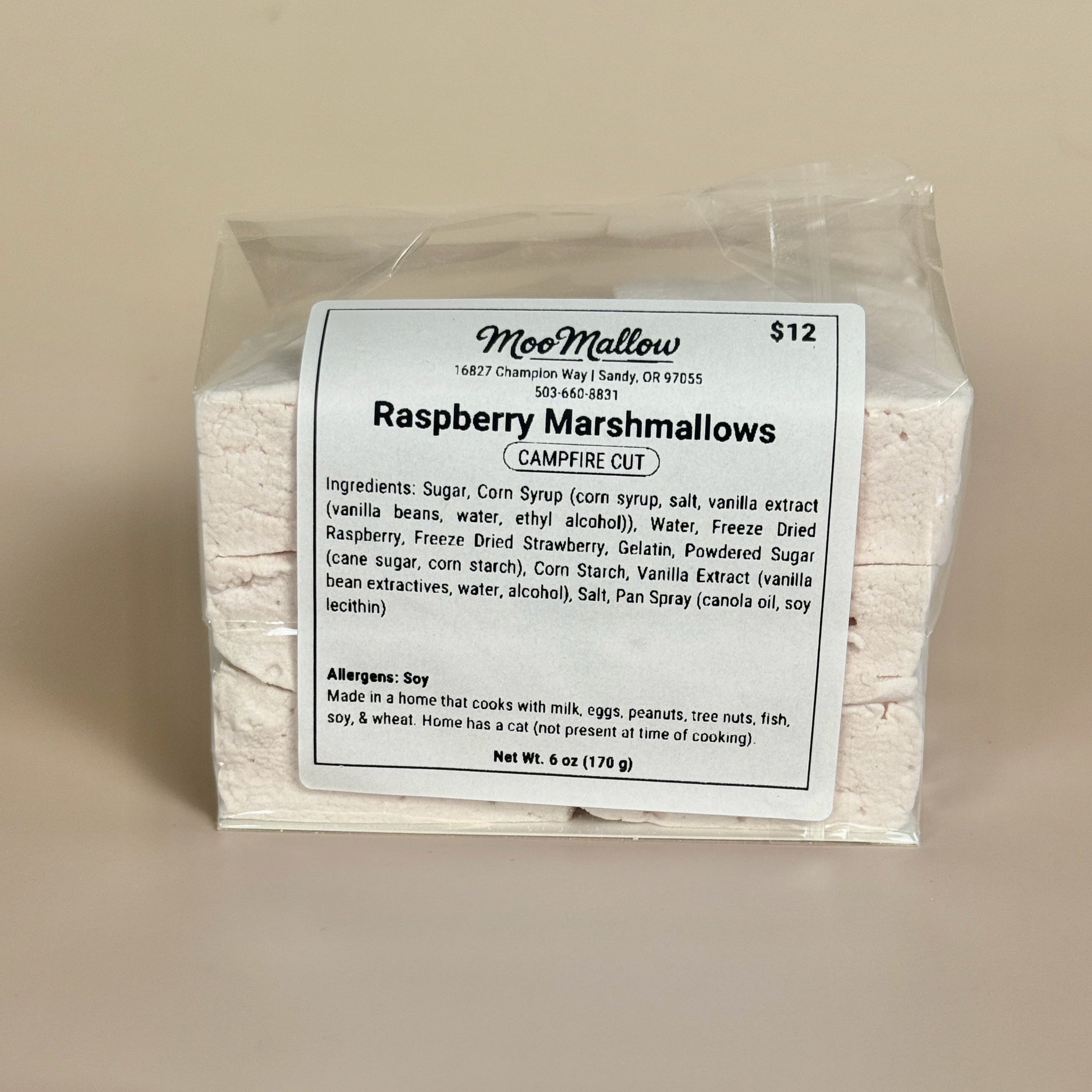 Packaged raspberry marshmallows with a label on a beige background
