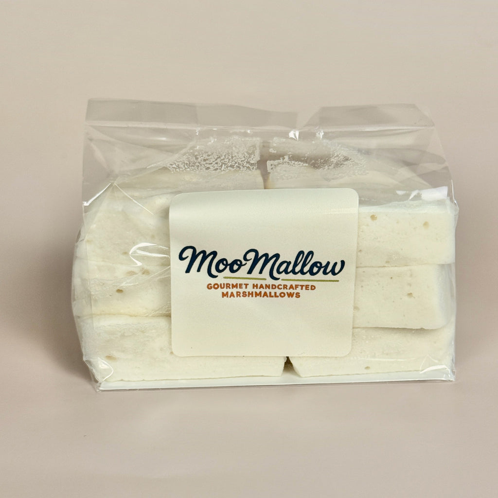 Packaged marshmallows with 'MooMallow' branding on a beige background